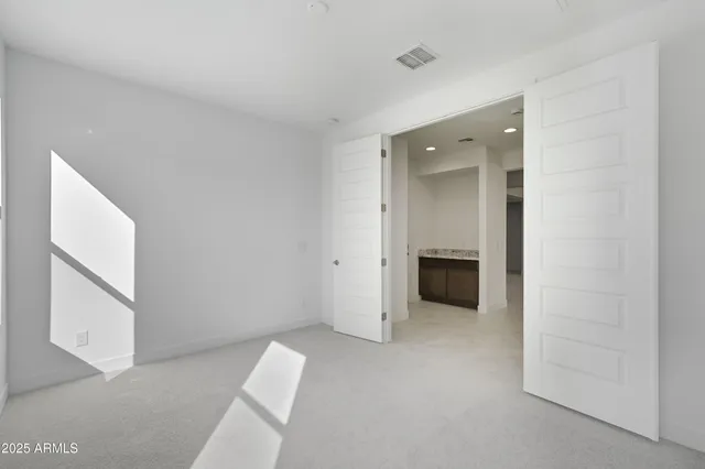a view of a livingroom with a hallway
