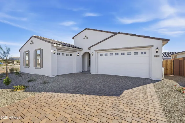 a view of a house with a snow in the background