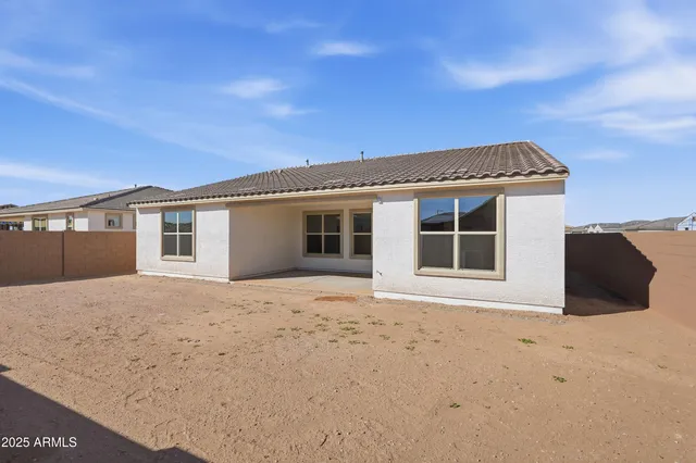 a front view of a house with a empty space