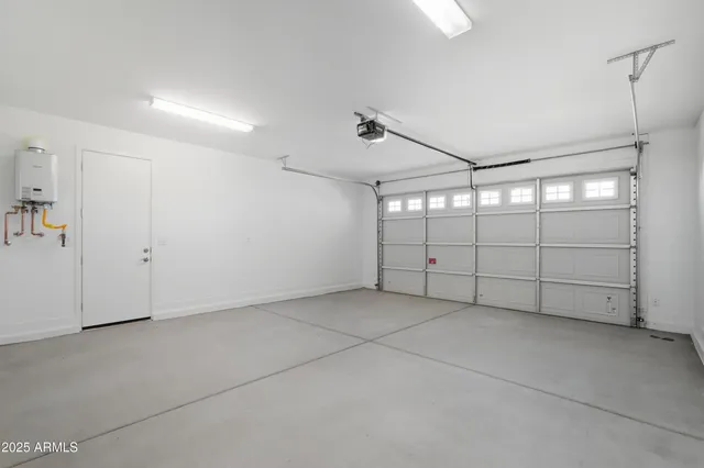 an aerial view of a house with a swimming pool