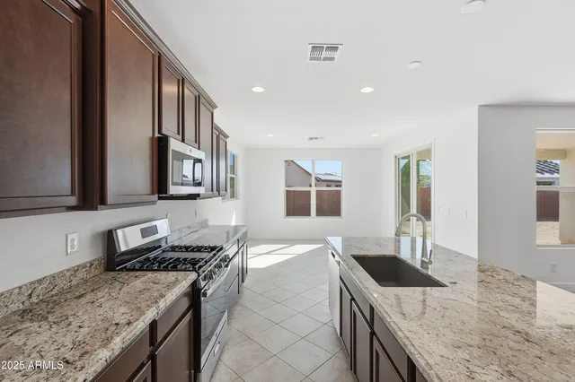 a kitchen with a stove and a sink