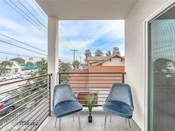 a view of a balcony with chairs