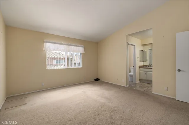 an empty room with a empty space and windows