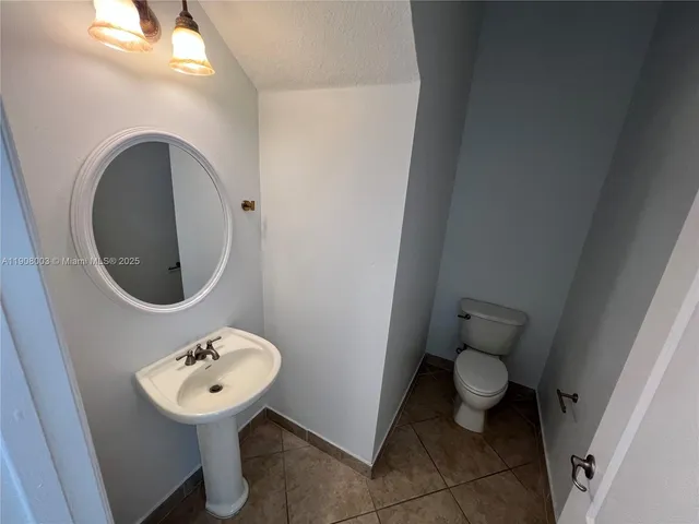 a bathroom with a toilet and a sink