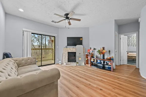 a living room with furniture and a fireplace