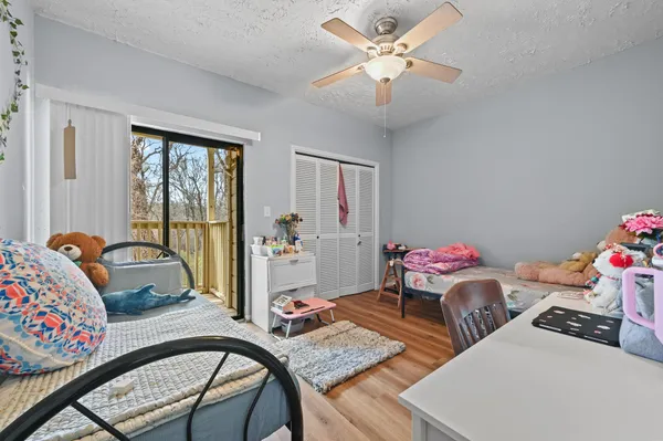 a bedroom with furniture and a window