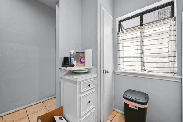 a kitchen with stainless steel appliances granite countertop a sink and a window