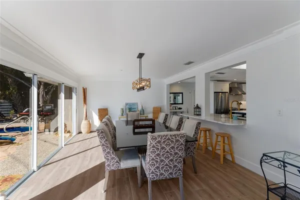 a kitchen with sink cabinets and wooden floor