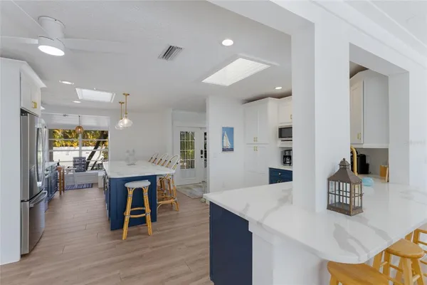 a view of living room with furniture and a chandelier