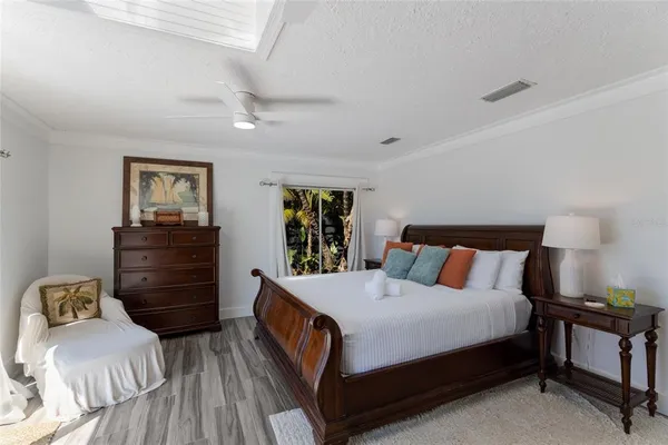 a bedroom with furniture and a window
