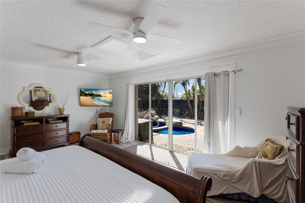 419 Clark Drive Holmes Beach, FL 34217 - Photo 24 of 53 a bedroom with furniture and a window