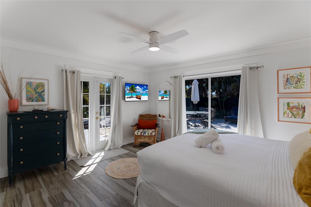 419 Clark Drive Holmes Beach, FL 34217 - Photo 26 of 53 a bedroom with furniture and a window