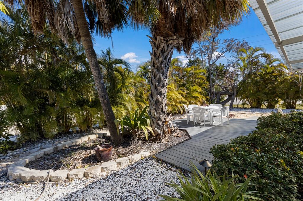 419 Clark Drive Holmes Beach, FL 34217 - Photo 37 of 53 a view of yard with trees