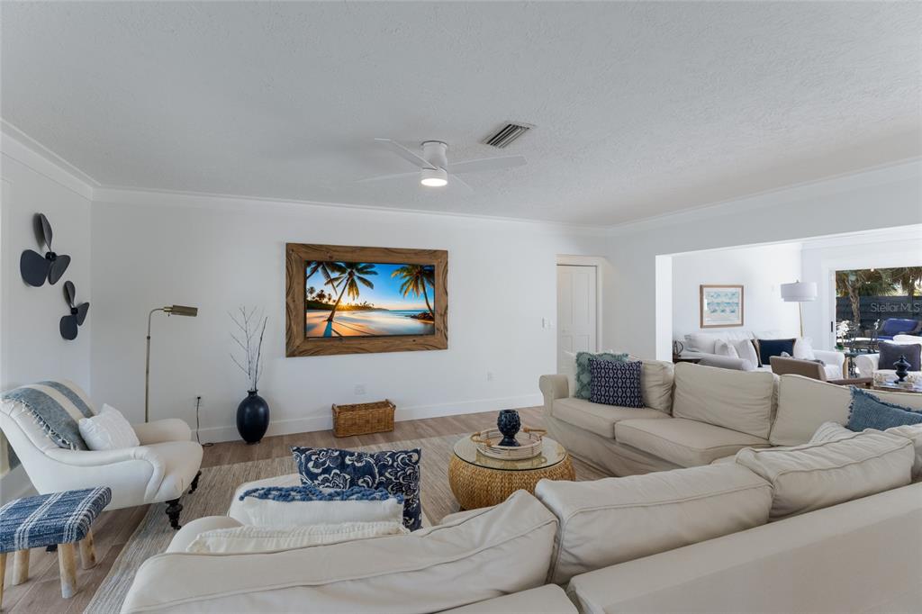 419 Clark Drive Holmes Beach, FL 34217 - Photo 4 of 53 a living room with furniture and a flat screen tv