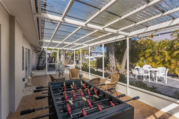 a view of a backyard with sitting area