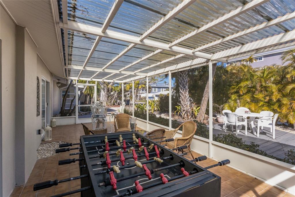 419 Clark Drive Holmes Beach, FL 34217 - Photo 41 of 53 a view of a chairs and tables in a patio