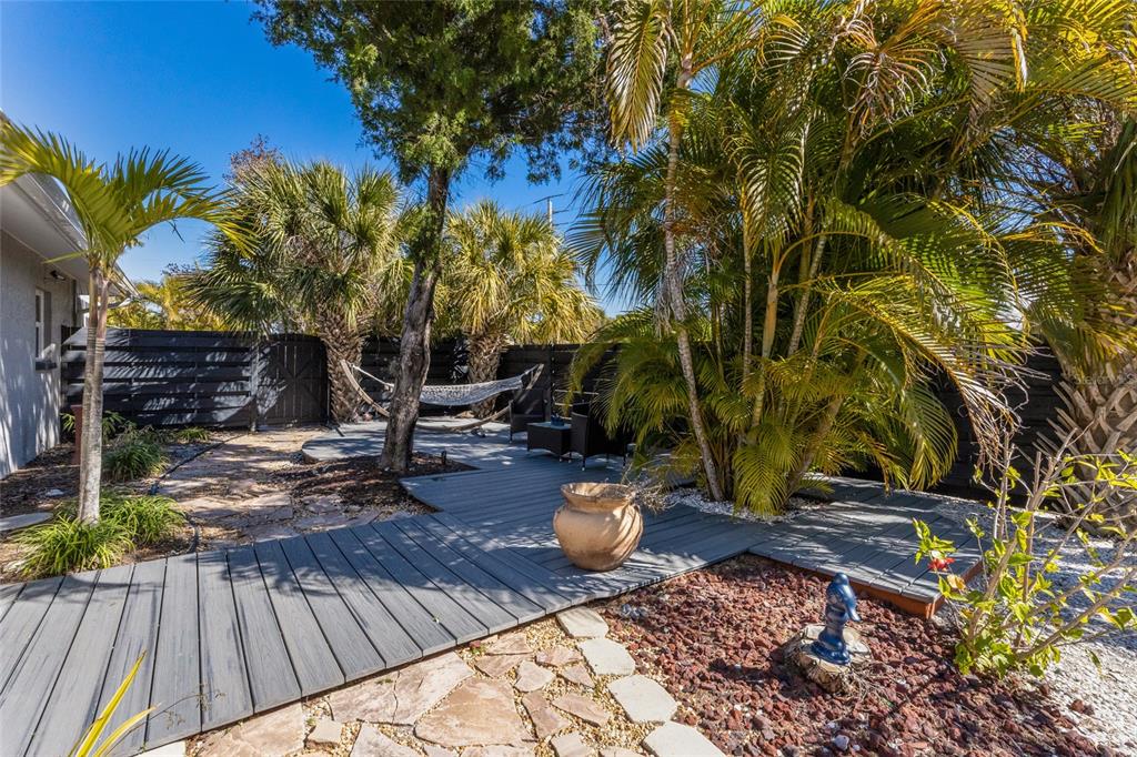 419 Clark Drive Holmes Beach, FL 34217 - Photo 43 of 53 a view of a backyard with sitting area