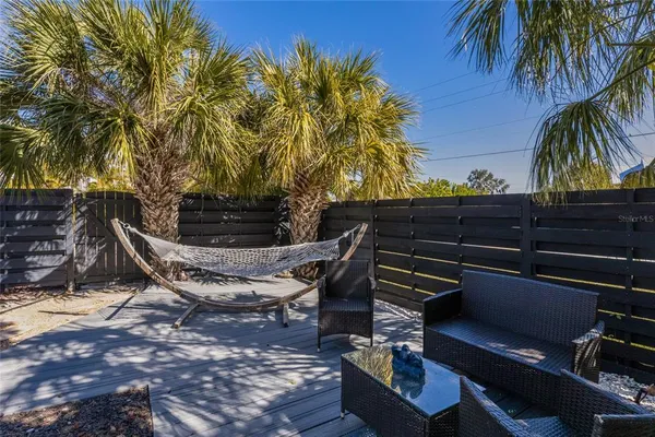 an aerial view of a house with yard swimming pool and outdoor seating