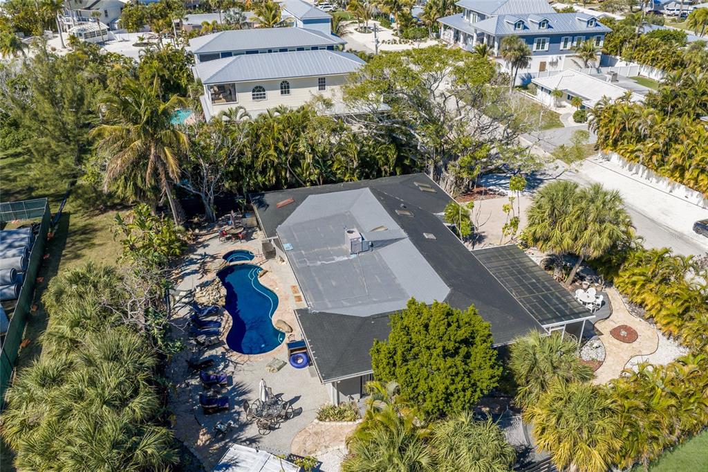 419 Clark Drive Holmes Beach, FL 34217 - Photo 45 of 53 an aerial view of a house with a yard and garden