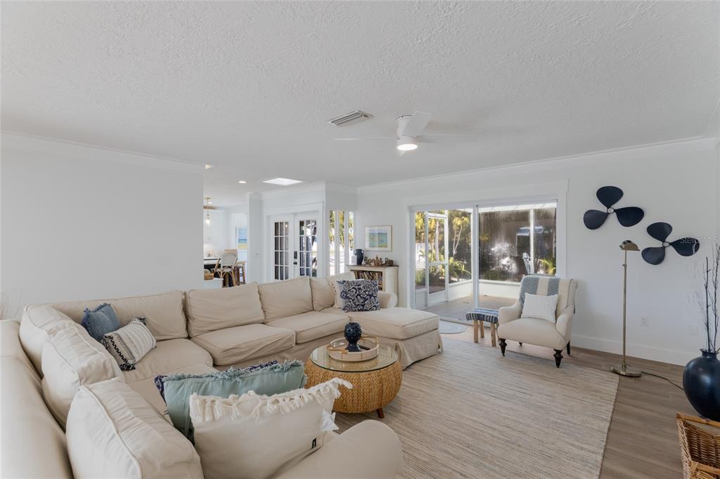 419 Clark Drive Holmes Beach, FL 34217 - Photo 6 of 53 a living room with furniture and wooden floor