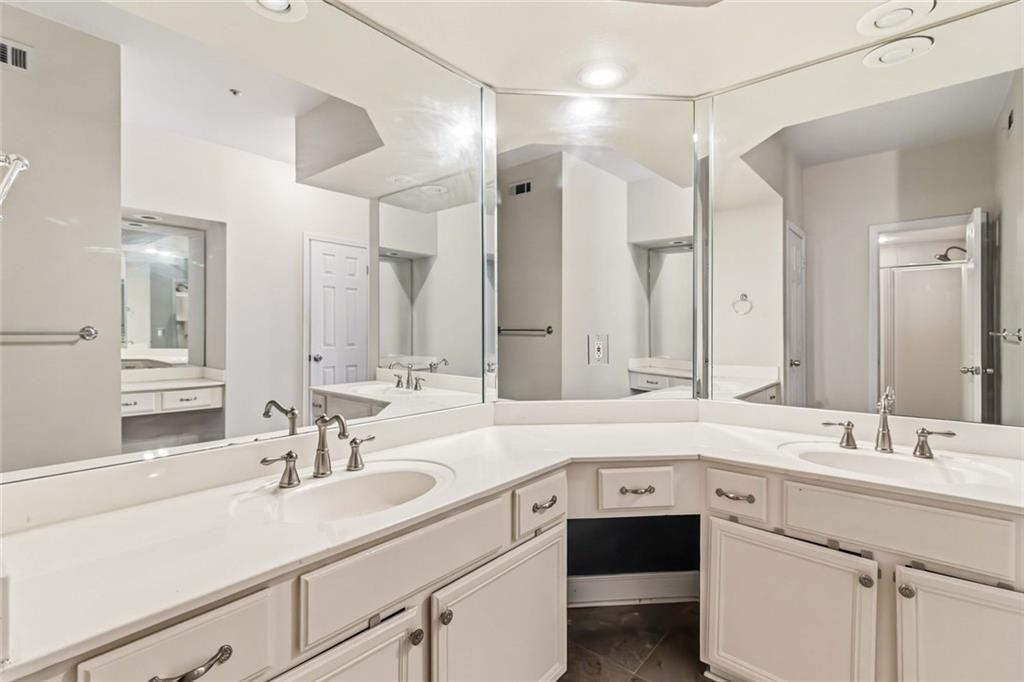 3777 Peachtree Road Northeast, Unit 533 Brookhaven, GA 30319 - Photo 12 of 30 a bathroom with a sink and a mirror