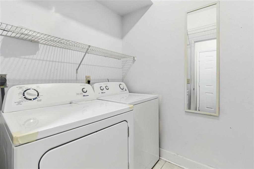 3777 Peachtree Road Northeast, Unit 533 Brookhaven, GA 30319 - Photo 16 of 30 a utility room with dryer and washer