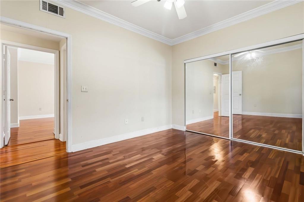 3777 Peachtree Road Northeast, Unit 533 Brookhaven, GA 30319 - Photo 17 of 30 a view of a room with wooden floor and a window