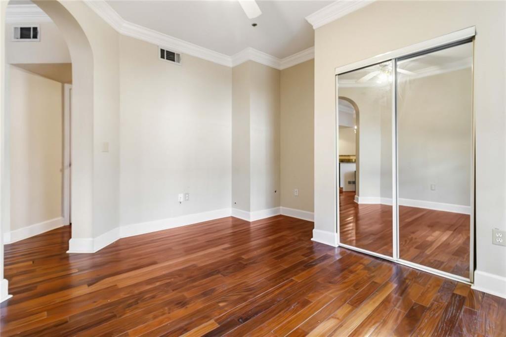 3777 Peachtree Road Northeast, Unit 533 Brookhaven, GA 30319 - Photo 19 of 30 a view of empty room with wooden floor