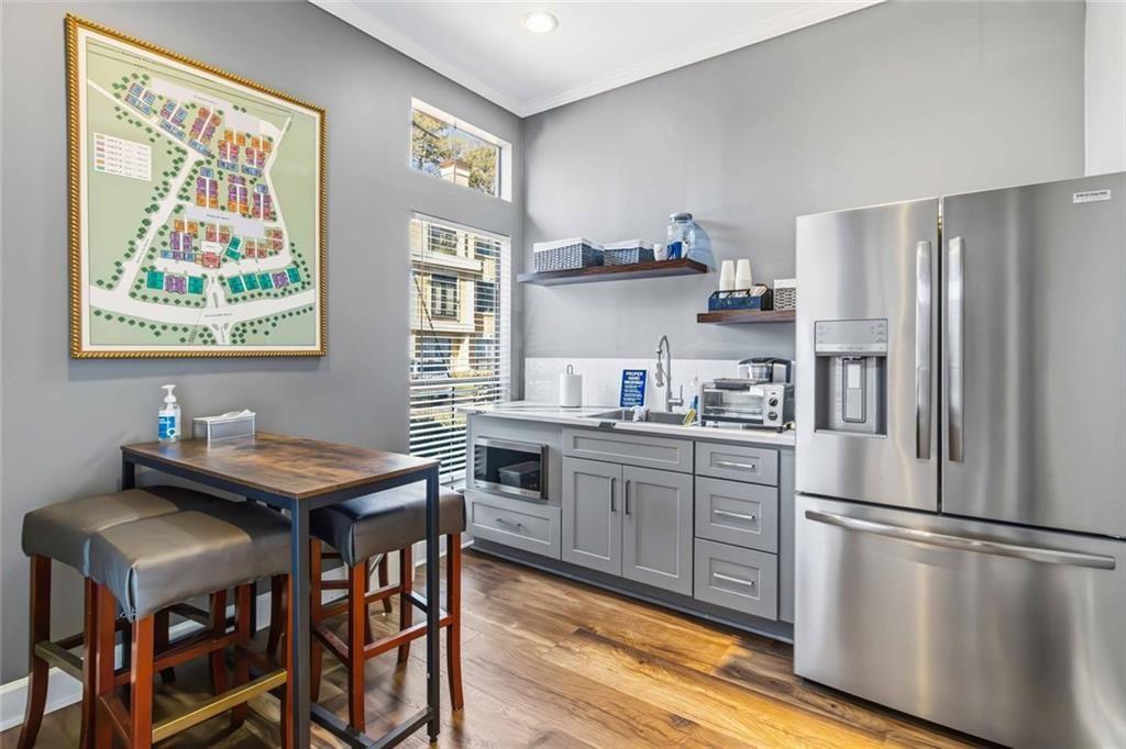 3777 Peachtree Road Northeast, Unit 533 Brookhaven, GA 30319 - Photo 4 of 30 a kitchen with stainless steel appliances granite countertop a refrigerator sink and stove