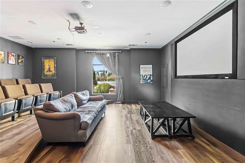 3777 Peachtree Road Northeast, Unit 533 Brookhaven, GA 30319 - Photo 5 of 30 a living room with furniture and a wooden floor