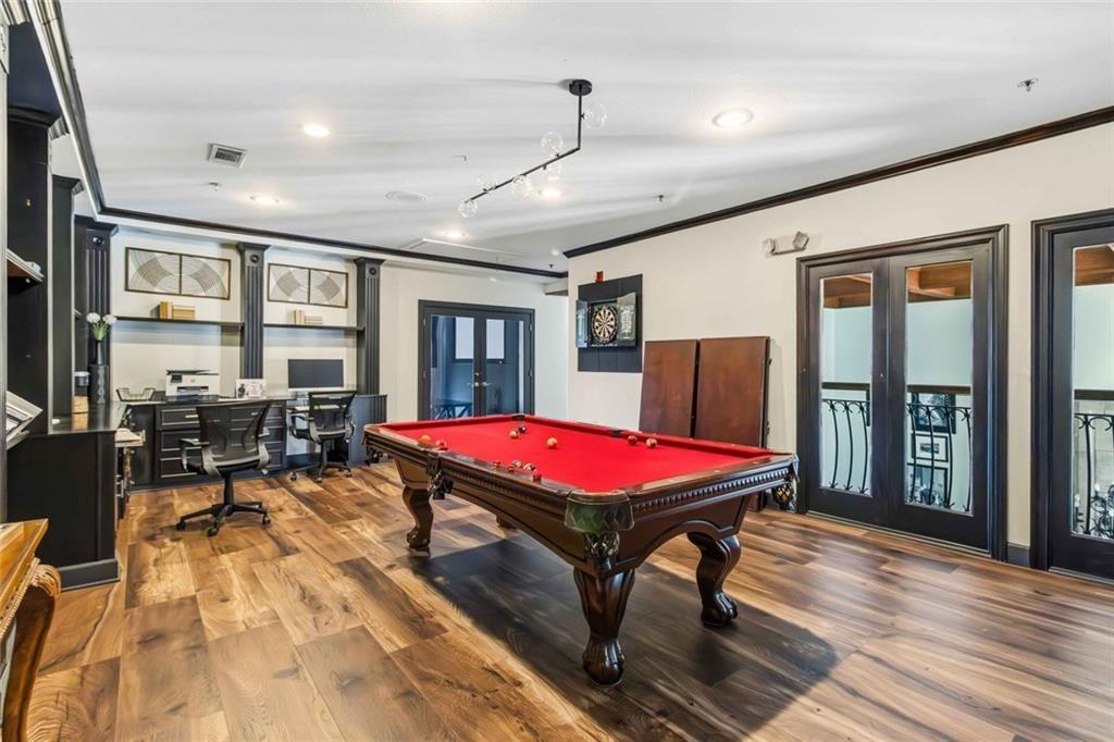 3777 Peachtree Road Northeast, Unit 533 Brookhaven, GA 30319 - Photo 6 of 30 a patio with lawn chairs and wooden floor