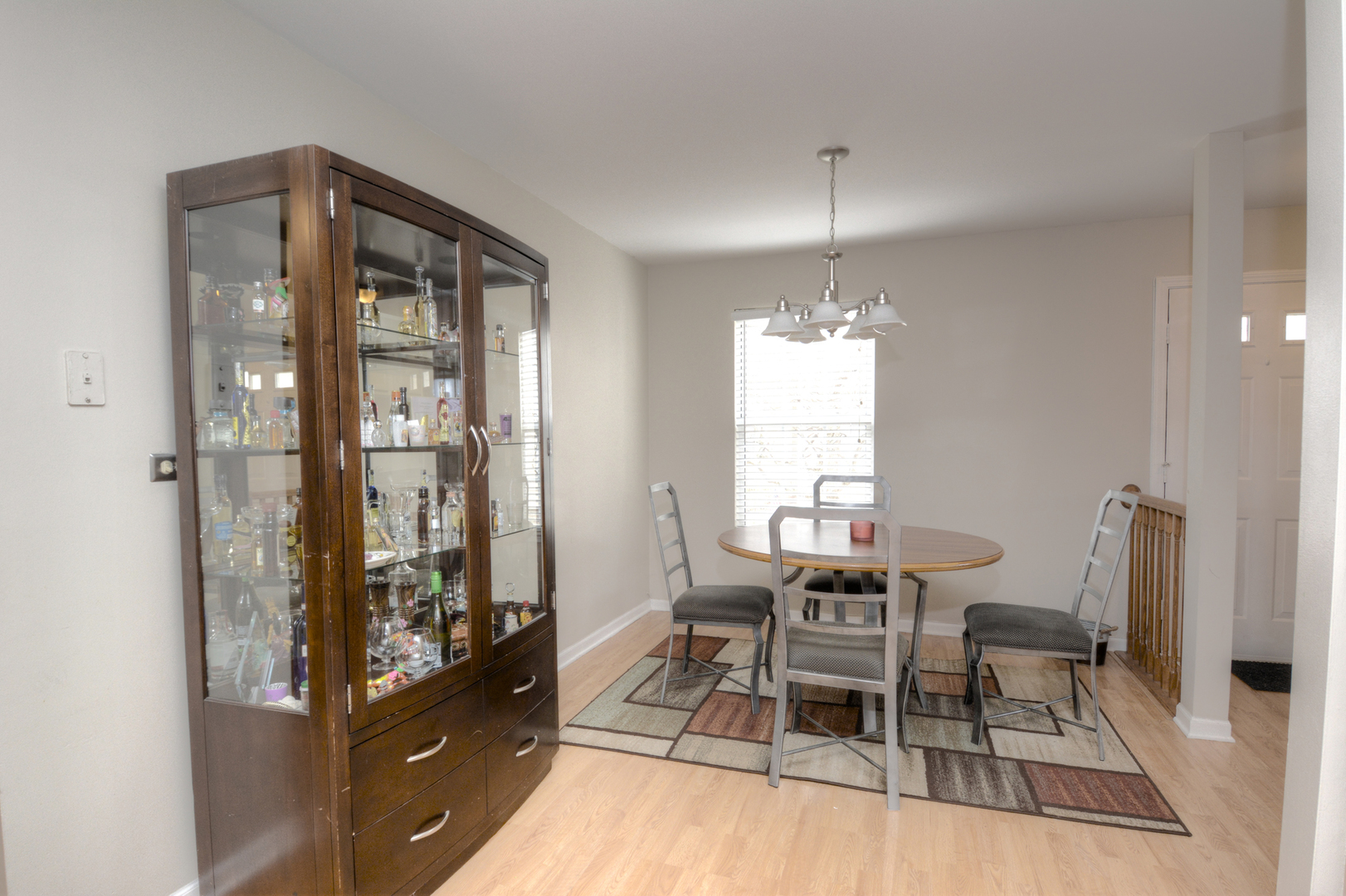 22 Tyler Court, Unit A Streamwood, IL 60107 - Photo 12 of 27 a dining room with furniture and window