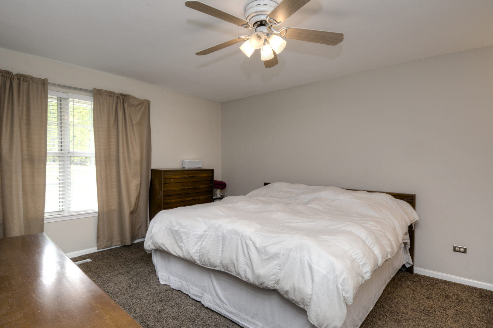 22 Tyler Court, Unit A Streamwood, IL 60107 - Photo 13 of 27 a bedroom with a bed and window