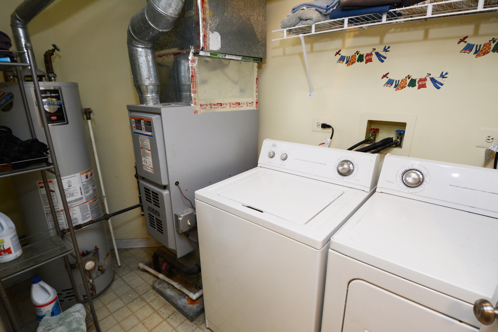 22 Tyler Court, Unit A Streamwood, IL 60107 - Photo 19 of 27 a utility room with dryer and washer