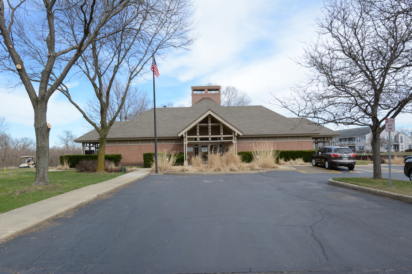 22 Tyler Court, Unit A Streamwood, IL 60107 - Photo 23 of 27 a view of a house with a yard and large trees