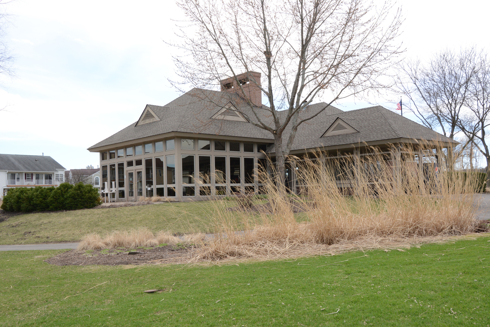 22 Tyler Court, Unit A Streamwood, IL 60107 - Photo 24 of 27 a view of a yard in front of a house with large trees