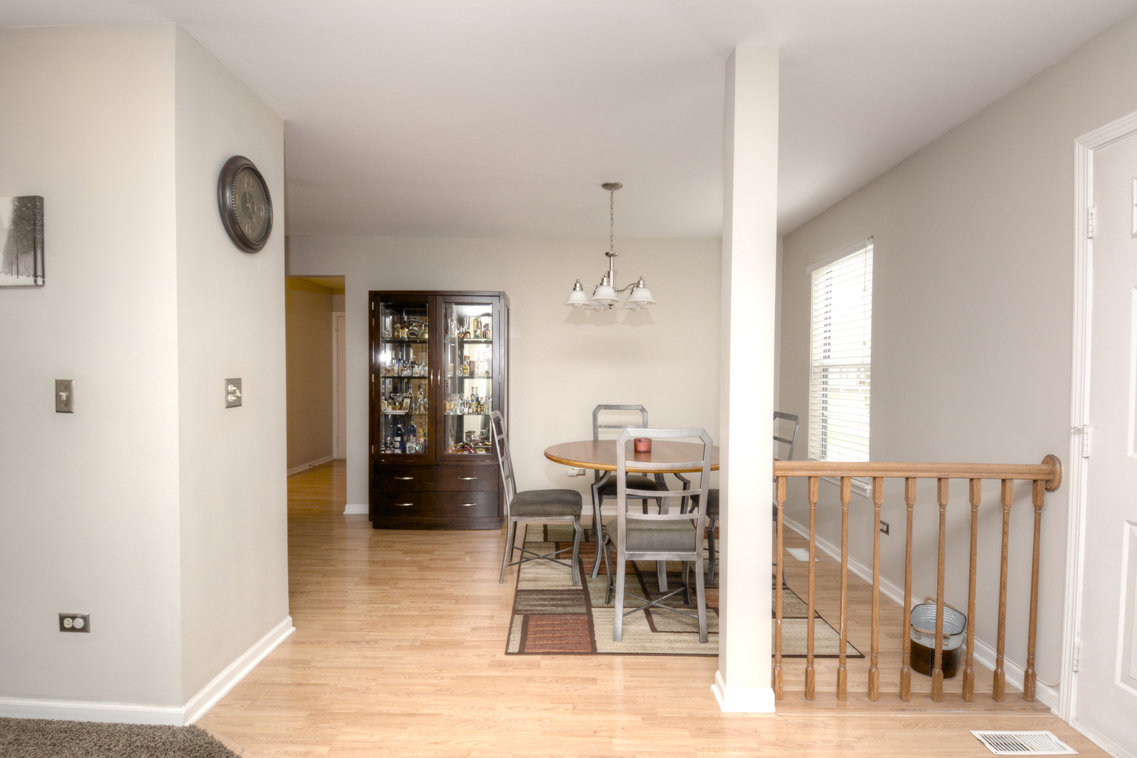 22 Tyler Court, Unit A Streamwood, IL 60107 - Photo 6 of 27 a view of a dining room with furniture and a chandelier