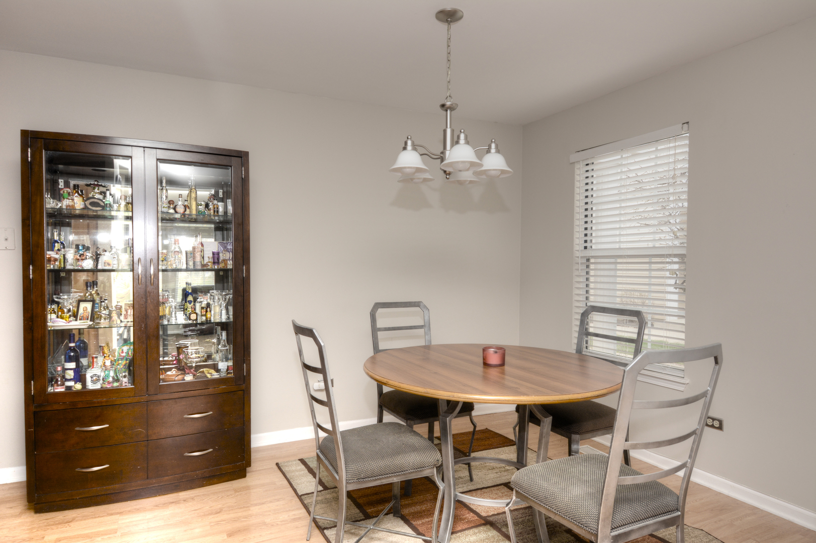 22 Tyler Court, Unit A Streamwood, IL 60107 - Photo 8 of 27 a view of a dining room with furniture and chandelier