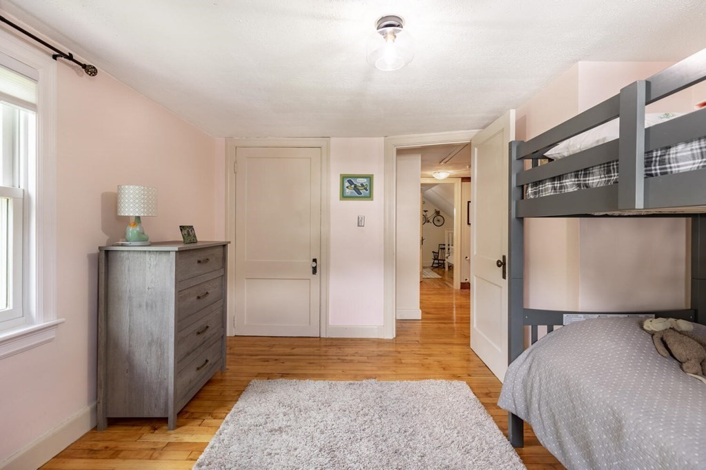 51 Ridge Street Arlington, MA 02474 - Photo 13 of 28 a bedroom with a bed and a rug