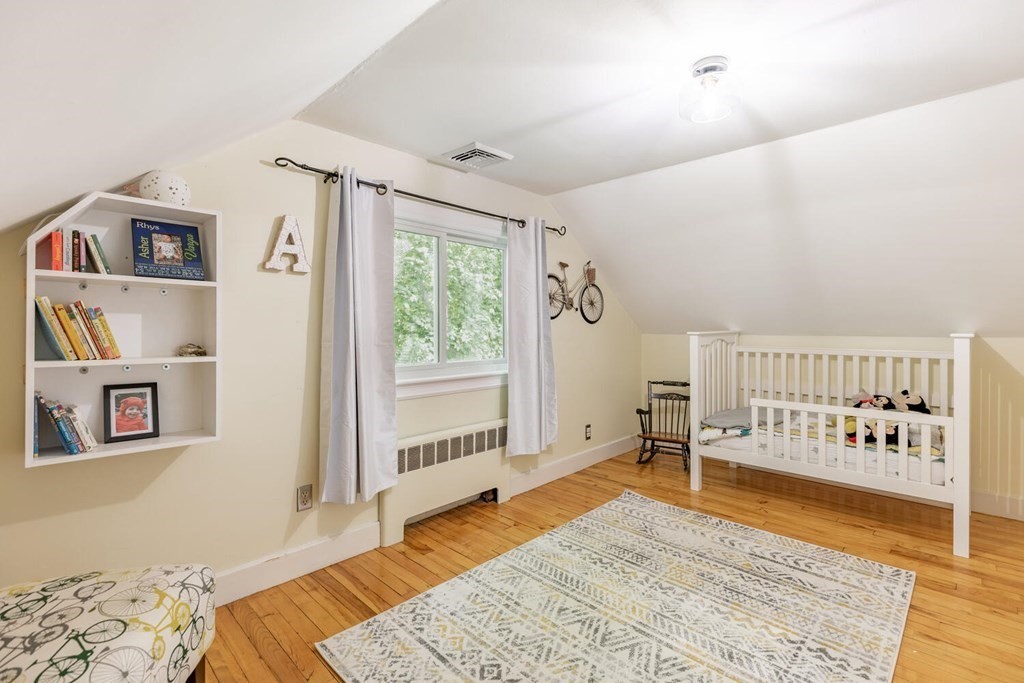 51 Ridge Street Arlington, MA 02474 - Photo 15 of 28 a bedroom with furniture and window