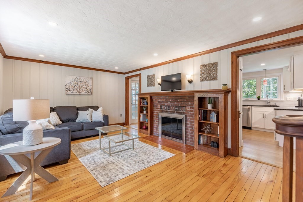 51 Ridge Street Arlington, MA 02474 - Photo 4 of 28 a living room with furniture and a fireplace