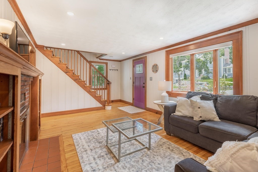 51 Ridge Street Arlington, MA 02474 - Photo 5 of 28 a living room with furniture and a large window