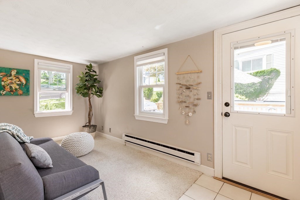 51 Ridge Street Arlington, MA 02474 - Photo 8 of 28 a living room with furniture and a window
