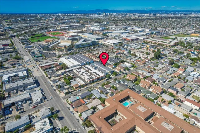 an aerial view of residential houses with yard