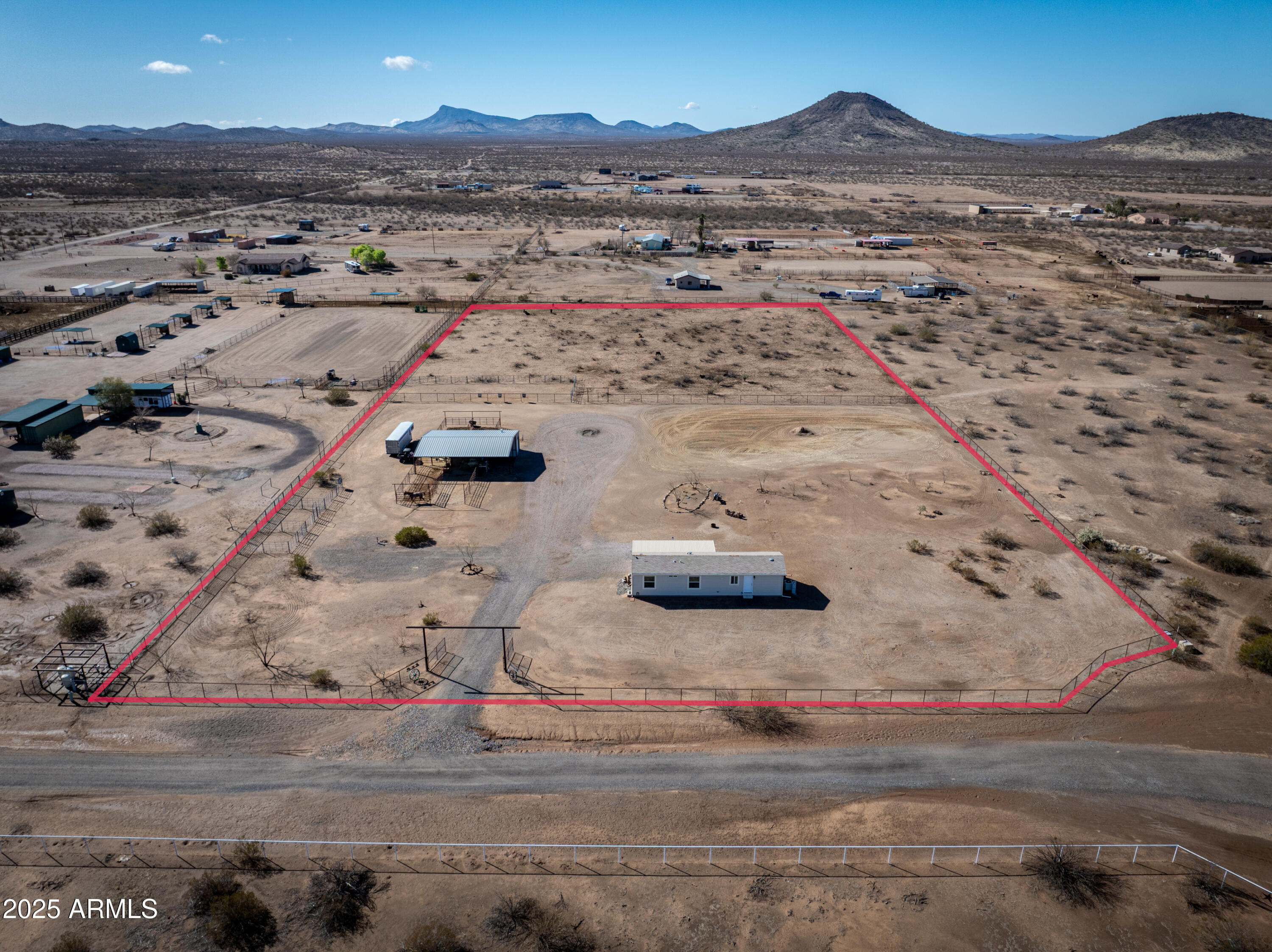 45409 West Luray Road Wickenburg, AZ 85390 - Photo 1 of 26 an aerial view of residential houses with outdoor space