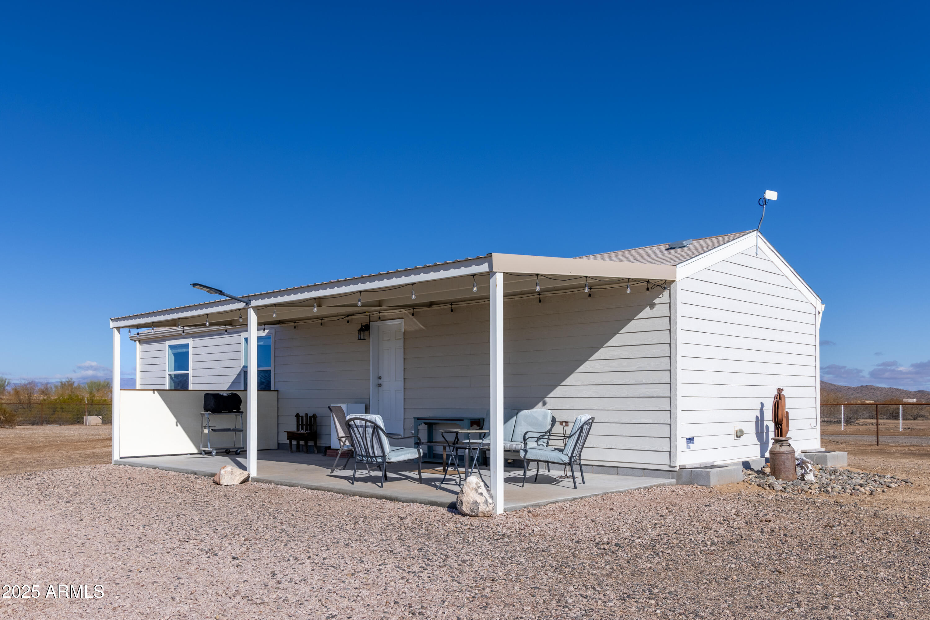 45409 West Luray Road Wickenburg, AZ 85390 - Photo 16 of 26 a view of two chairs in front of house