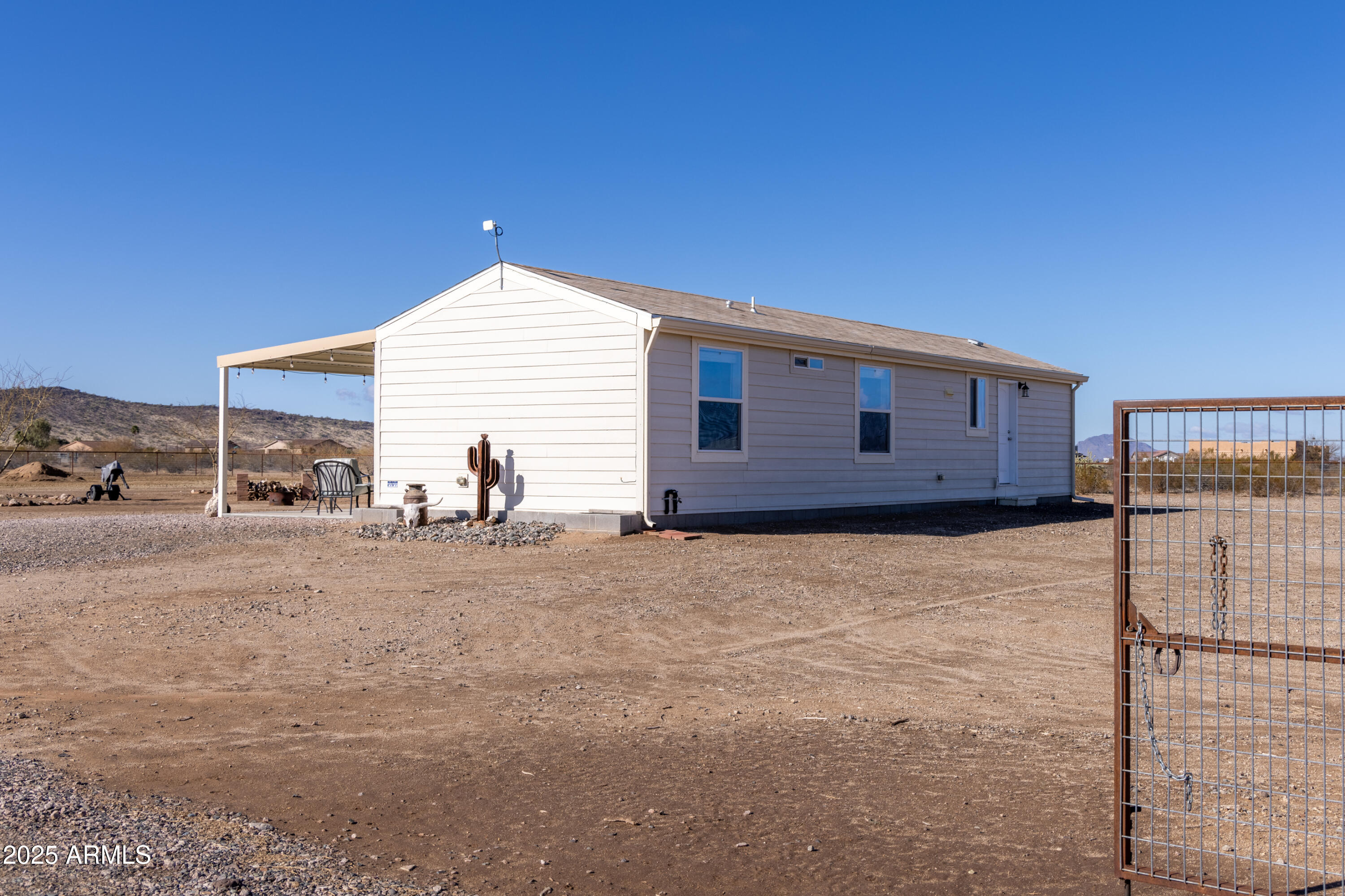45409 West Luray Road Wickenburg, AZ 85390 - Photo 3 of 26 a house view with a backyard space