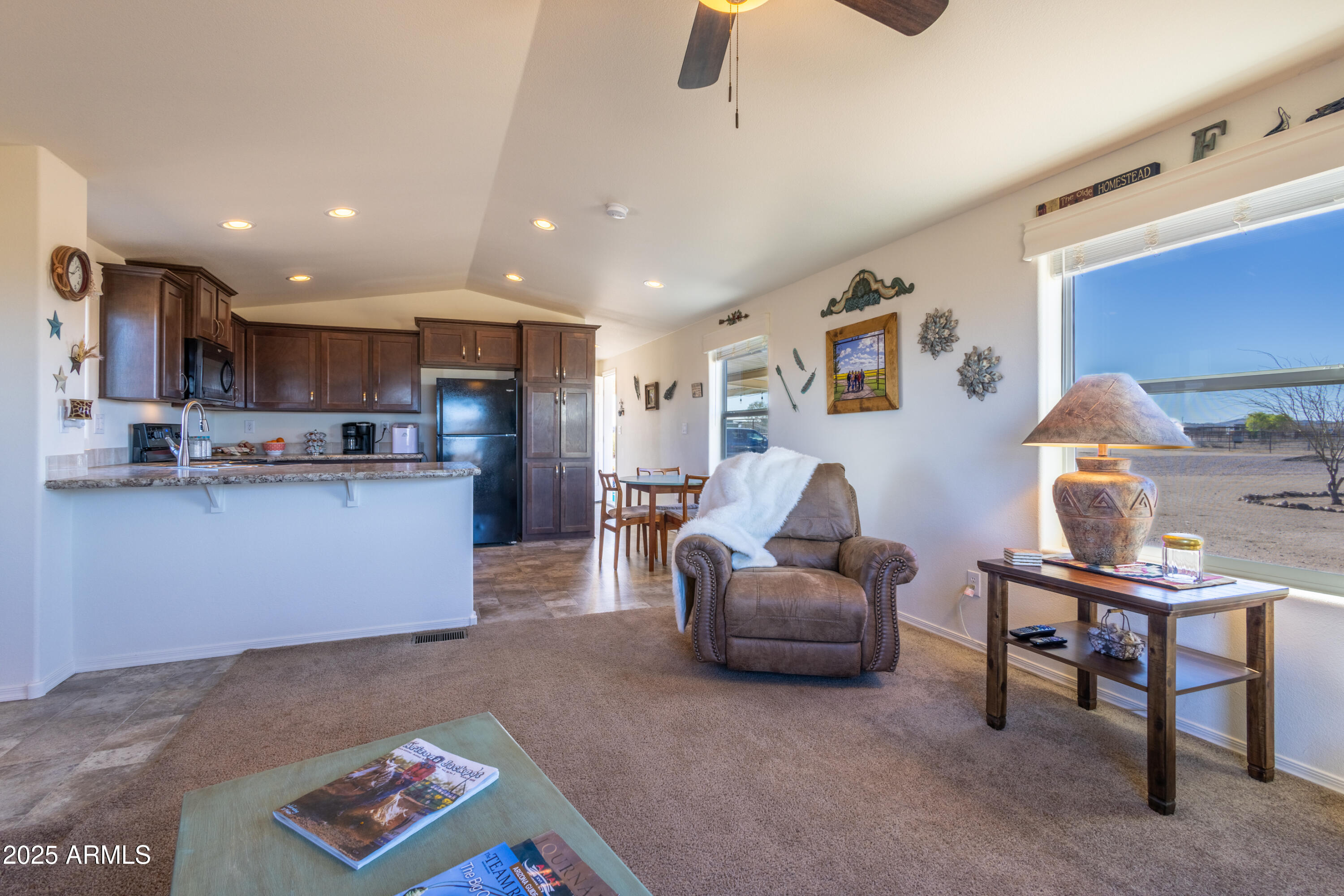 45409 West Luray Road Wickenburg, AZ 85390 - Photo 7 of 26 a living room with furniture and a kitchen view
