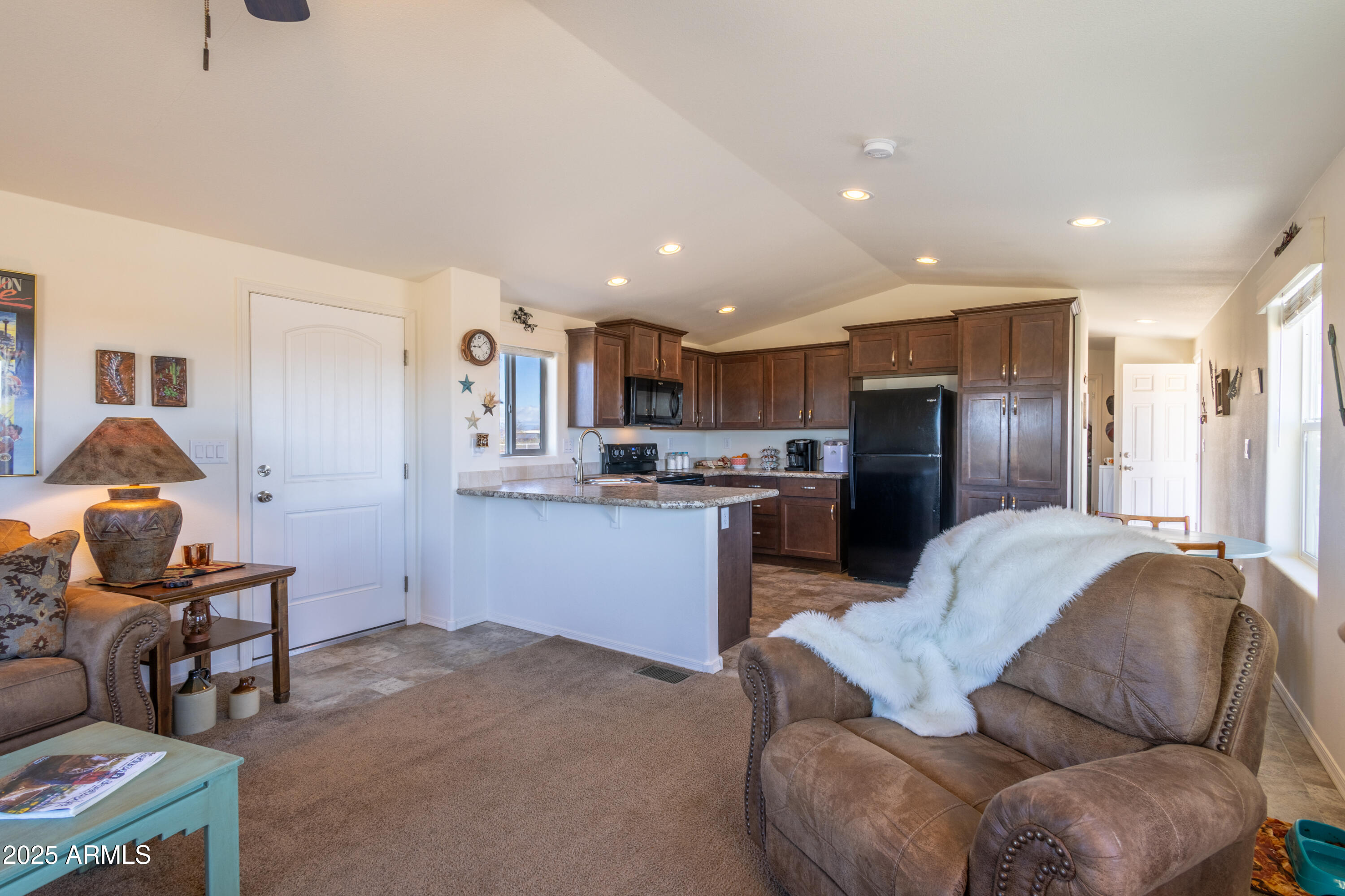 45409 West Luray Road Wickenburg, AZ 85390 - Photo 8 of 26 a living room with furniture and a kitchen