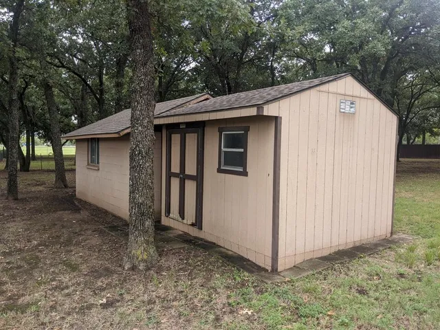a view of a house with a yard and garage